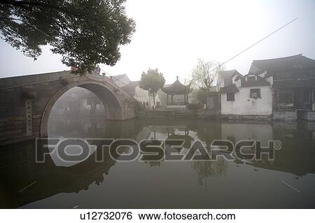 Riverside in the morning fog, Xi Tang, China View Large Photo Image Stock Photograph - Riverside in the morning fog, Xi Tang, China. Fotosearch