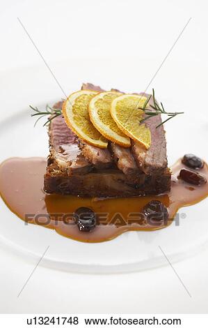 Roast duck with orange sauce View Large Photo Image Stock Photo - Roast duck with orange sauce. Fotosearch