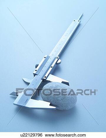 Rock and caliper View Large Photo Image Stock Photograph - Rock and caliper. Fotosearch