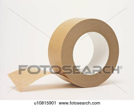 Stock Image - Roll of packing tape, close up, white background. Fotosearch
