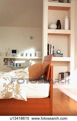 Stock Photography - Room with bed and shelves. Fotosearch