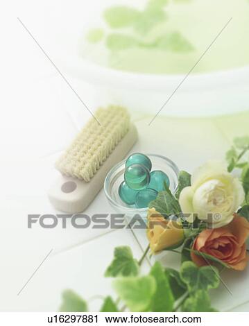 Stock Image - Roses and toiletries on tile. Fotosearch