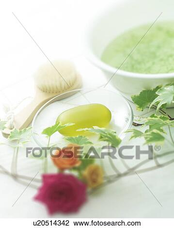 Stock Image - Roses and toiletries on tile. Fotosearch