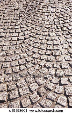 Stock Image - Rough Cobblestones in a Pattern. Kawasaki, Kanagawa Prefecture. Fotosearch