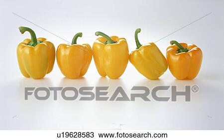 Row of yellow bell peppers View Large Photo Image Stock Image - Row of yellow bell peppers. Fotosearch