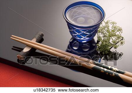 Stock Photography - Sake and chopsticks. Fotosearch
