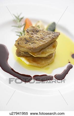 Stock Photography - Sauteed meat with foie gras. Fotosearch