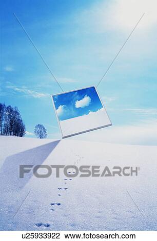 Stock Image - Screen showing blue sky and clouds in winter landscape. Fotosearch