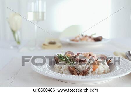 Seafood and rice dish on white table View Large Photo Image Stock Photograph - Seafood and rice dish on white table. Fotosearch