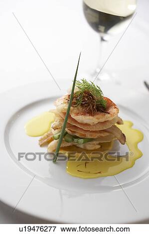 Stock Photo - Seafood stack with sauce. Fotosearch