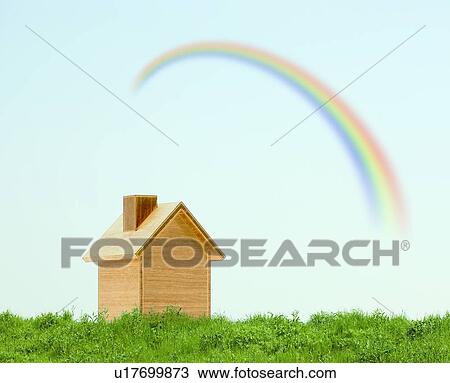 Stock Image - Shed on Green Hill and Rainbow in Sky. Fotosearch
