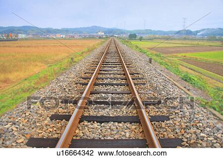 Stock Image -  Shigaraki Kogen Railway surrounded by fields. Koka, Shiga Prefecture, Japan. Fotosearch