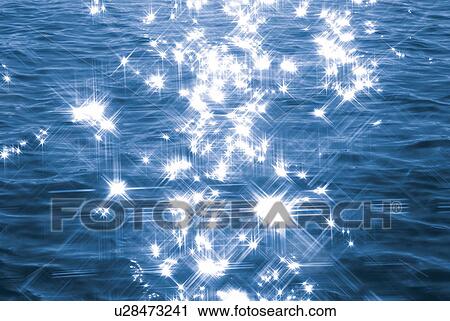 Stock Image - Shining water surface, lens flare, full frame. Fotosearch