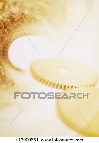 Stock Image - Silver gear going down the drain. Fotosearch