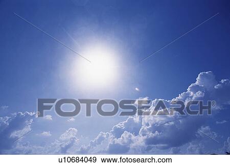 Stock Photo - Sky with Clouds and Sun. Fotosearch