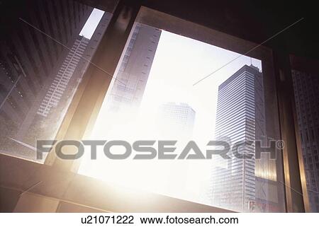 Skyscrapers in sunshine seen through building window. Shinjuku, Tokyo, Japan View Large Photo Image Stock Image - Skyscrapers in sunshine seen through building window. Shinjuku, Tokyo, Japan. Fotosearch