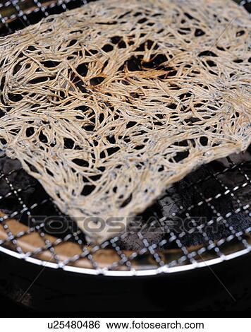 Slice of dried fish on grill, close up View Large Photo Image Stock Photograph - Slice of dried fish on grill, close up. Fotosearch