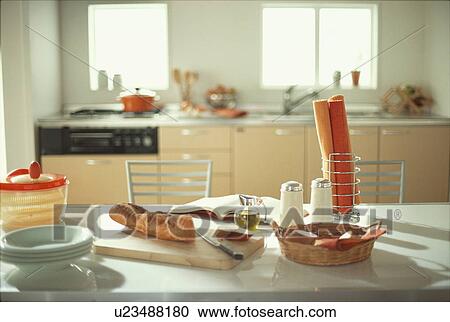 Sliced baguette on kitchen counter View Large Photo Image Stock Image - Sliced baguette on kitchen counter. Fotosearch