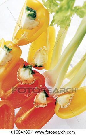 Stock Photo - Sliced bell peppers and celery, white background. Fotosearch