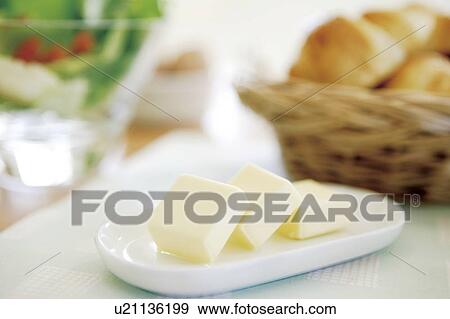 Sliced butter on plate View Large Photo Image Stock Photo - Sliced butter on plate. Fotosearch