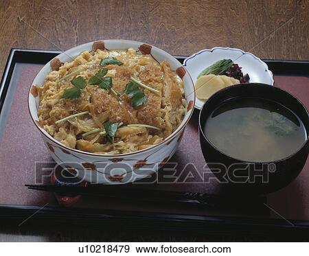 Stock Photo - Slices of deep fried pork on rice in bowl. Fotosearch
