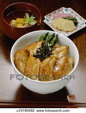 Slices of grilled chicken on rice in bowl View Large Photo Image Stock Image - Slices of grilled chicken on rice in bowl. Fotosearch