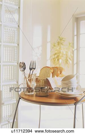 Picture - Small table set for breakfast. Fotosearch