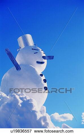 Stock Photo - Snowman against a blue sky. Fotosearch