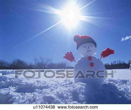 Snowman in the sun View Large Photo Image Stock Photo - Snowman in the sun. Fotosearch