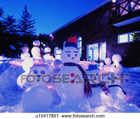 Snowmen gather in the yard as evening begins View Large Photo Image Stock Image - Snowmen gather in the yard as evening begins. Fotosearch