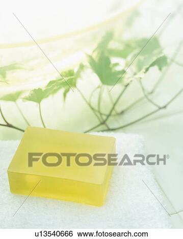 Stock Photograph - Soap on towel, close up. Fotosearch
