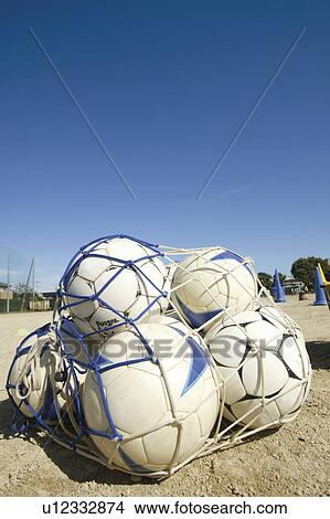 Soccer balls in a net View Large Photo Image Picture - Soccer balls in a net. Fotosearch