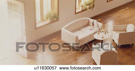 Stock Photo - Sofa and chairs in spacious room. Fotosearch
