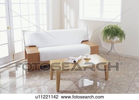 Sofa and coffee table in light room View Large Photo Image Stock Image - Sofa and coffee table in light room. Fotosearch