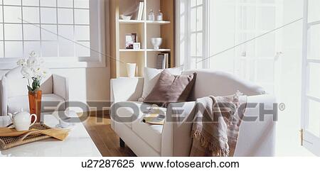 Sofa and coffee table in sunny room View Large Photo Image Stock Photography - Sofa and coffee table in sunny room. Fotosearch
