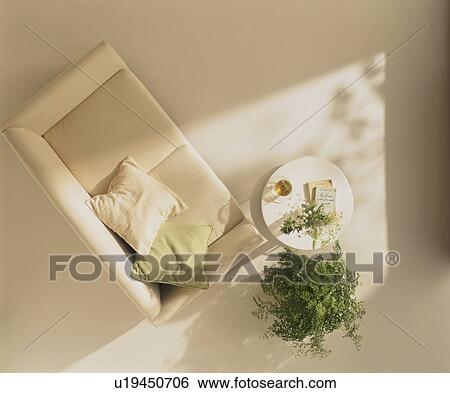 Sofa and coffee table with pot plant View Large Photo Image Stock Photograph - Sofa and coffee table with pot plant. Fotosearch