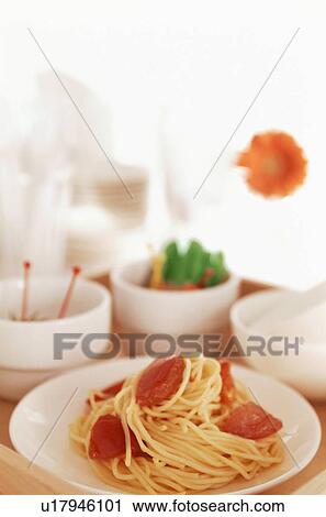 Stock Image - Spaghetti and tomato with appetizers. Fotosearch