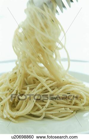 Spaghetti on plate with green herbs View Large Photo Image Stock Image - Spaghetti on plate with green herbs. Fotosearch