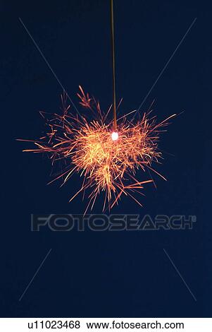 Sparkler firework in midnight blue sky View Large Photo Image Stock Photo - Sparkler firework in midnight blue sky. Fotosearch