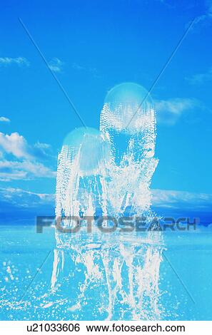 Spheres rising from water into sky View Large Photo Image Stock Photograph - Spheres rising from water into sky. Fotosearch