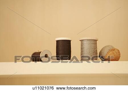 Spool of threads and pin cushion View Large Photo Image Stock Photograph - Spool of threads and pin cushion. Fotosearch