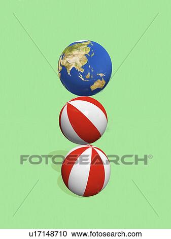Stack of balls and globe View Large Photo Image Stock Image - Stack of balls and globe. Fotosearch
