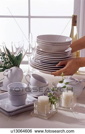 Stock Photograph - Stacks of white crockery. Fotosearch
