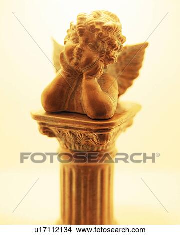 Picture - Statue of angel, colored background. Fotosearch