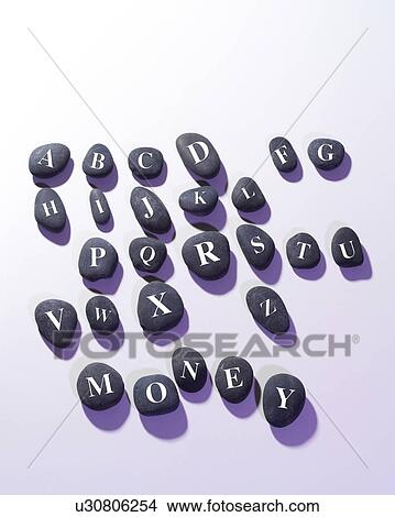 Picture - Stones with alphabet letters written. Fotosearch