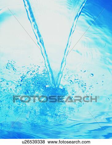 Stock Photo - Stream of water pouring to surface. Fotosearch