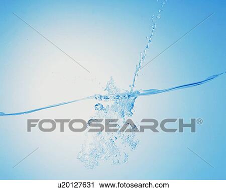 Stock Image - String of water drops falling to surface. Fotosearch
