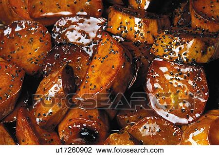 Stock Image - Sugar glazed sweet potatoes. Fotosearch