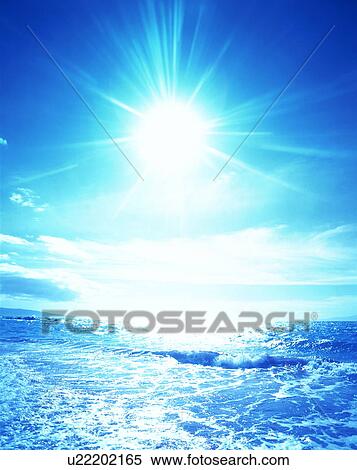 Stock Photography - Sun and clouds over sea. Fotosearch