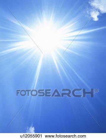 Stock Image - Sun, blue sky and clouds. Fotosearch